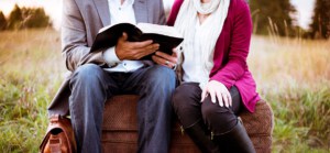 man and woman with bible